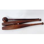 Turned hardwood knobkerry and a pair of Indian exercise clubs (3)