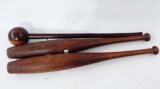 Turned hardwood knobkerry and a pair of Indian exercise clubs (3)