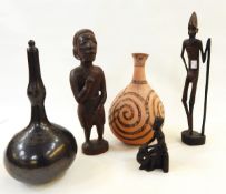 African carved wooden figure of a man, a wooden bowl, a vase,