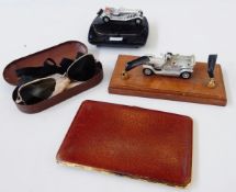 " The Complete Mercedes Story", an AA car badge and other car badges, an ashtray with model car,