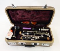 Clarinet within its original case, with cleaner, marked 'Boosey & Hawkes,