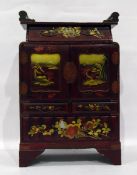 Japanese lacquered table cabinet, red lacquered with gilt decoration, landscape scenes,