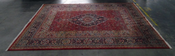Large Persian Beshir wool carpet with central dark and pale blue arabesque,