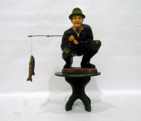 20th century ceramic painted crouching fisherman with rod and fish,