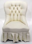 White upholstered buttonback chair