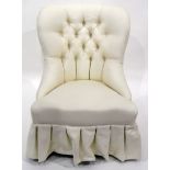 White upholstered buttonback chair