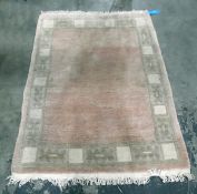 Chinese style wool rug in pastel shades of pink and celadon green,