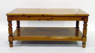 Modern pine rectangular-top coffee table with moulded edge, turned supports to undershelf,