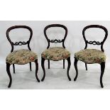 Set of four Victorian mahogany balloonback dining chairs with serpentine-fronted seats and foliate