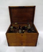 19th century oak apothecary's box fitted with arrangements of bottles and jars,