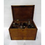 19th century oak apothecary's box fitted with arrangements of bottles and jars,