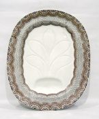 Late 19th century earthenware meat dish, oval, with shaped gullies and well,