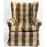 Wingback armchair upholstered in brown and cream check cover