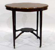 Edwardian mahogany oval-top occasional table with wavy moulded edge and satinwood inlays,