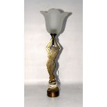 1920s brass-finish metal table lamp modelled as a two-dimensional nude female supporting a glass