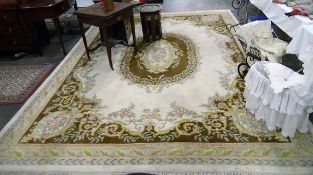 Large Chinese wool carpet, ivory ground with oval green,