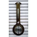Aneroid barometer in an oak case, with silver temperature dial, by Day Master,