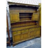 Reproduction stained fruitwood dresser, the three-tier platerack with pair of cupboards,
