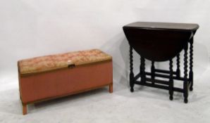 Oak gateleg table with spiral twist supports and a Lloyd Loom style ottoman with an upholstered lid