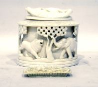 Early 20th century ivory lidded box with carved relief of animals, including elephant, lion,