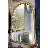 Art Nouveau style gilt framed arched wall mirror with domed top,