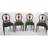 Set of four oval backed dining chairs with green upholstered seats,