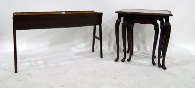 Early 20th century nest of three tables with glass inset tops,