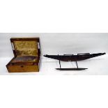 19th century writing box with brass inlay and an Eastern wooden boat