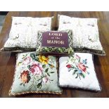 Two tapestry and velvet cushions with braid edges,
