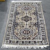 Beige ground, rectangular rug with triple totem,