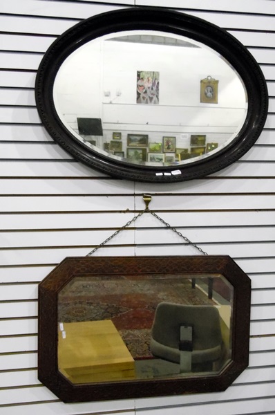 Oval wall mirror with bevelled plate and another carved oak framed wall mirror (2)