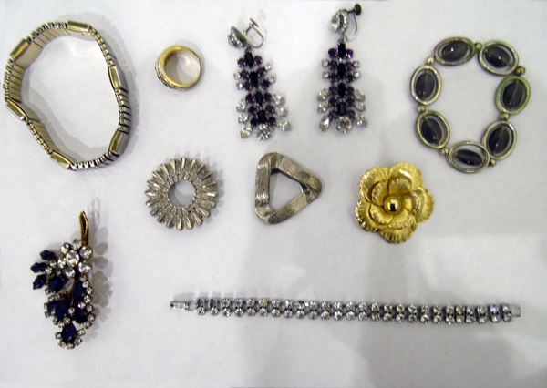 Quantity of costume jewellery to include beaded necklaces, bangles, rings, brooches,