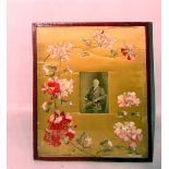 Large red leather gilt tooled photograph frame with embroidered and silk applique flowers,