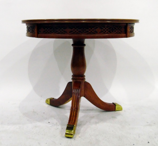 Reproduction walnut circular tripod table with reeded splayed legs, on brass feet,
