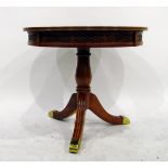 Reproduction walnut circular tripod table with reeded splayed legs, on brass feet,