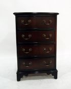 20th century reproduction mahogany chest of four short drawers, on bracket feet,