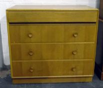 Meredew light oak dressing chest of four long drawers,