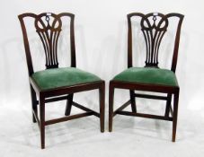 LOT WITHDRAWN Set of four late Georgian style mahogany dining chairs with shaped crest rails,