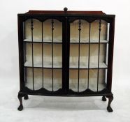 Mahogany bowfronted display cabinet with glazed doors enclosing three shelves,