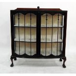 Mahogany bowfronted display cabinet with glazed doors enclosing three shelves,