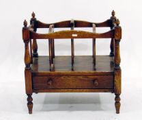 Reproduction oak canterbury with open magazine racks, frieze drawer, on turned supports,