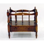 Reproduction oak canterbury with open magazine racks, frieze drawer, on turned supports,