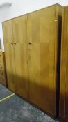 Enfurn mid 20th century light oak bedroom suite to include tall chest of five drawers,