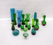 Quantity of green coloured glassware to include 20th century glass vases,