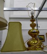 Gold metal standard lamp with cream shade