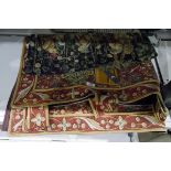 Tapestry wall hanging depicting medieval figures and with roaring lion and another tapestry wall