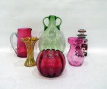 Quantity of coloured glass to include green glass two-handled bottle,