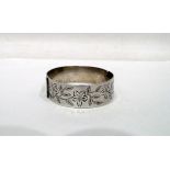Mid 20th century silver bangle with floral engraving, Birmingham, 42g or 1.