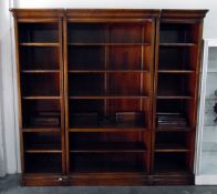 Mahogany library bookcase of three parts, comprising six shelves, on a plinth base,