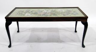 Oak rectangular-top coffee table with glazed floral needlework panel,
